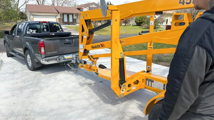 Our professional tree service fleet, featuring a heavy-duty truck and towable lift ready for residential and municipal contracts in Wichita.