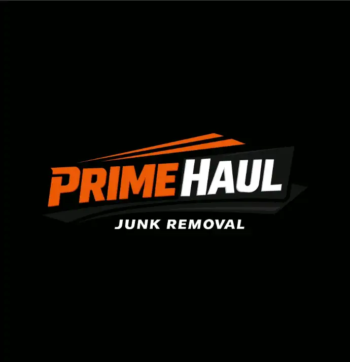 A bold, high-impact logo for PrimeHaul Junk Removal featuring a strong, stylized truck icon and thick, industrial-style typography. The design uses a high-contrast color palette—like safety orange and charcoal gray—to project power, reliability, and efficiency.