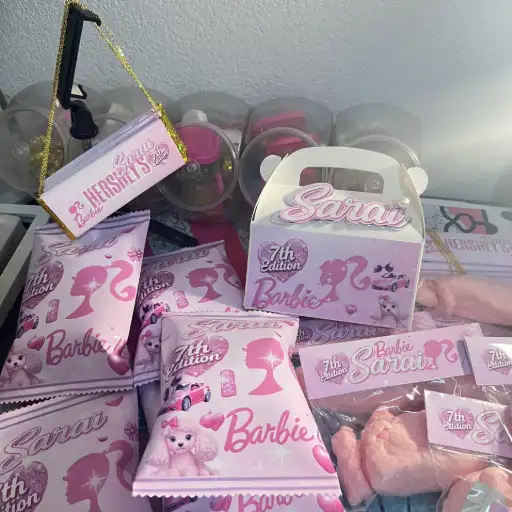 A close-up of custom EvervCreations party favors on a clean marble surface, featuring sharp personalization details, soft natural lighting, and elegant ribbon accents.
